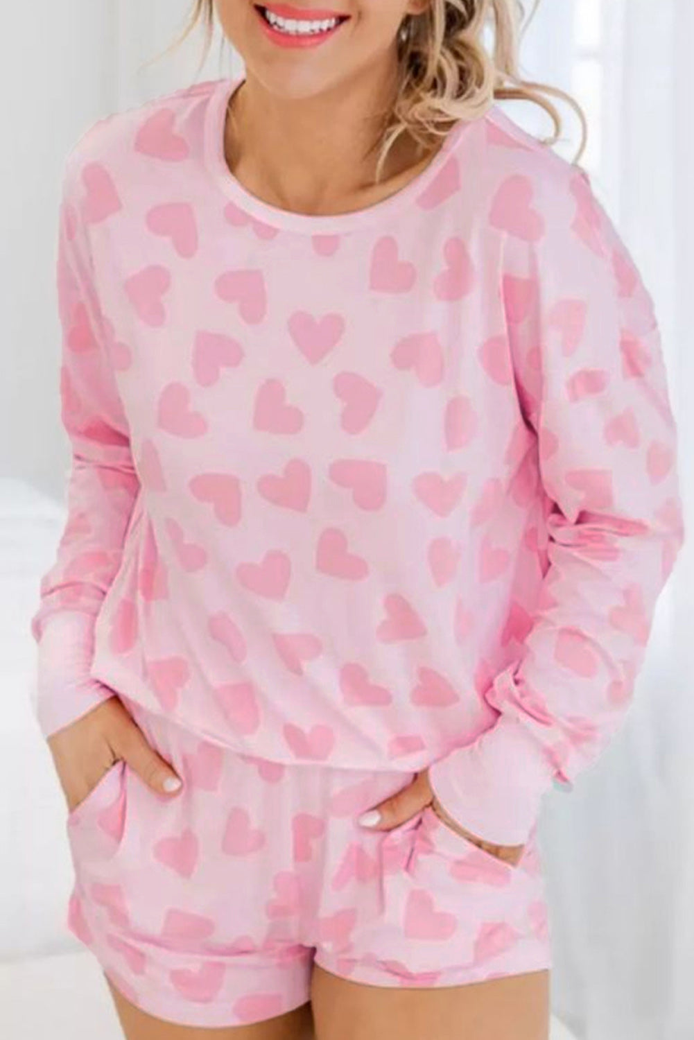 Cozy and stylish pink plus-size sweater with heart checkered design
