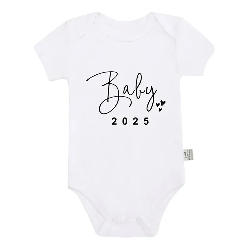 Baby 2025 bodysuit laid out for photo reveal