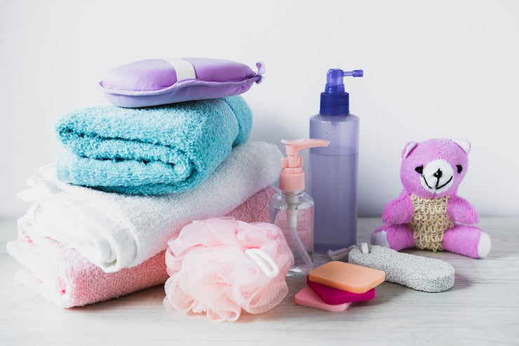 Essential baby accessories like bibs, pacifiers, socks, and toys for newborns and toddlers.