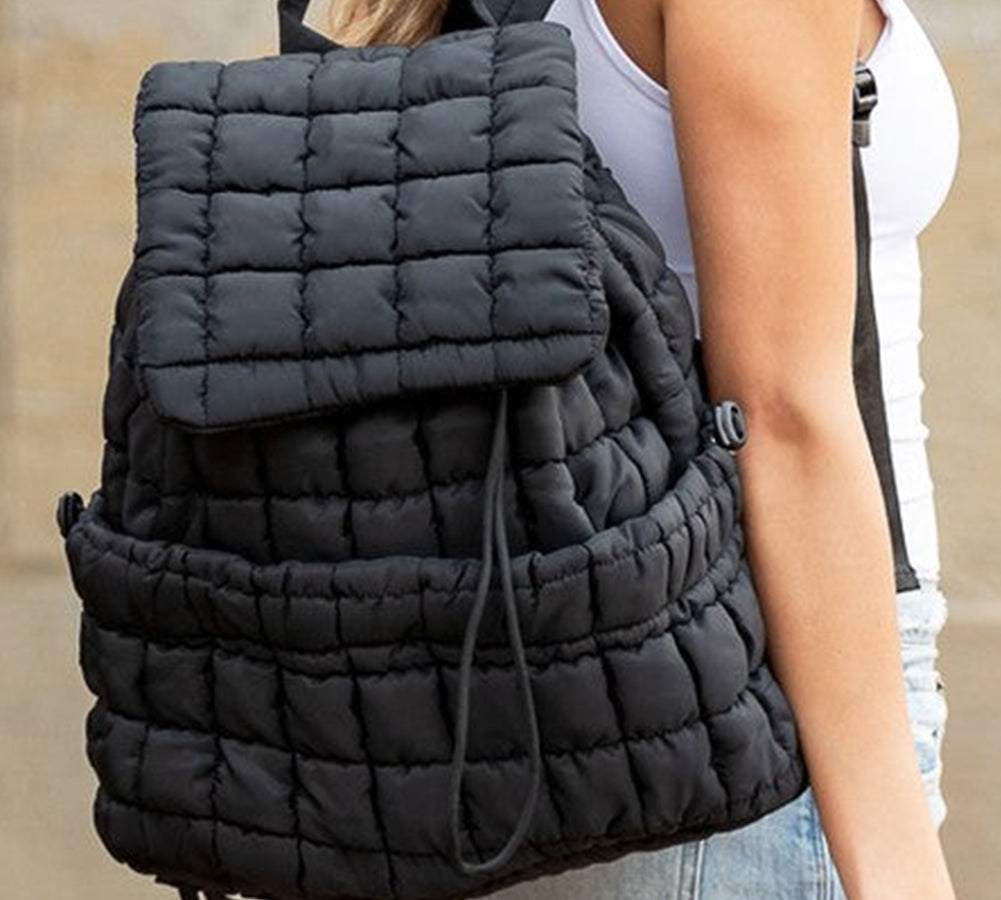 Stylish black puffer backpack with quilted pattern and spacious compartments