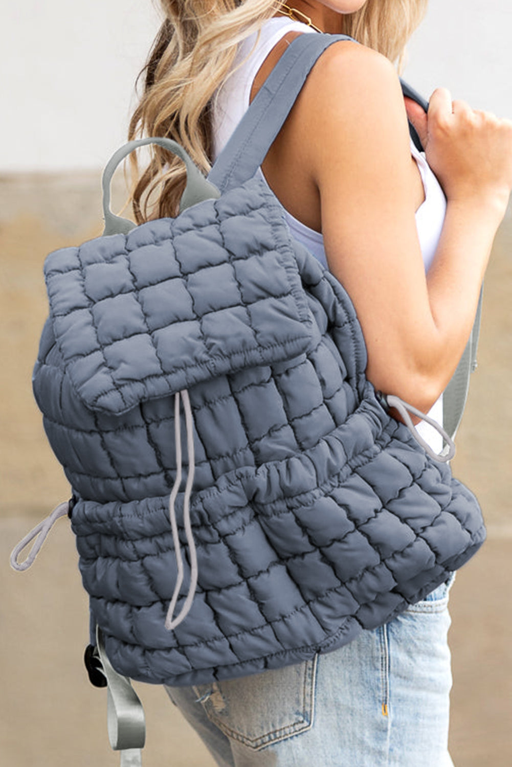 Modern black puffer backpack with quilted design and sleek look
