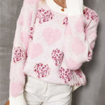 Cozy and stylish women’s sweater with pink heart and leopard print