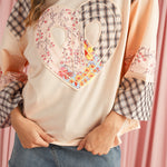 Stylish long sleeve top with plaid and floral patchwork design