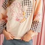Stylish long sleeve top with plaid and floral patchwork design
