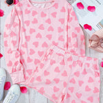 Soft and comfortable pink plus-size sweater with heart checkered print