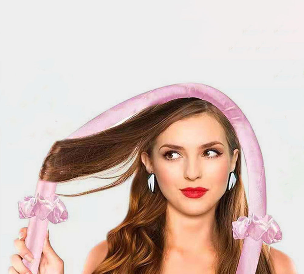 Pink heatless hair curler band creating smooth, voluminous curls