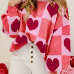 Cozy pink sweater with heart checkered design and lantern sleeves