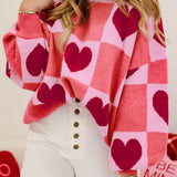 Cozy pink sweater with heart checkered design and lantern sleeves