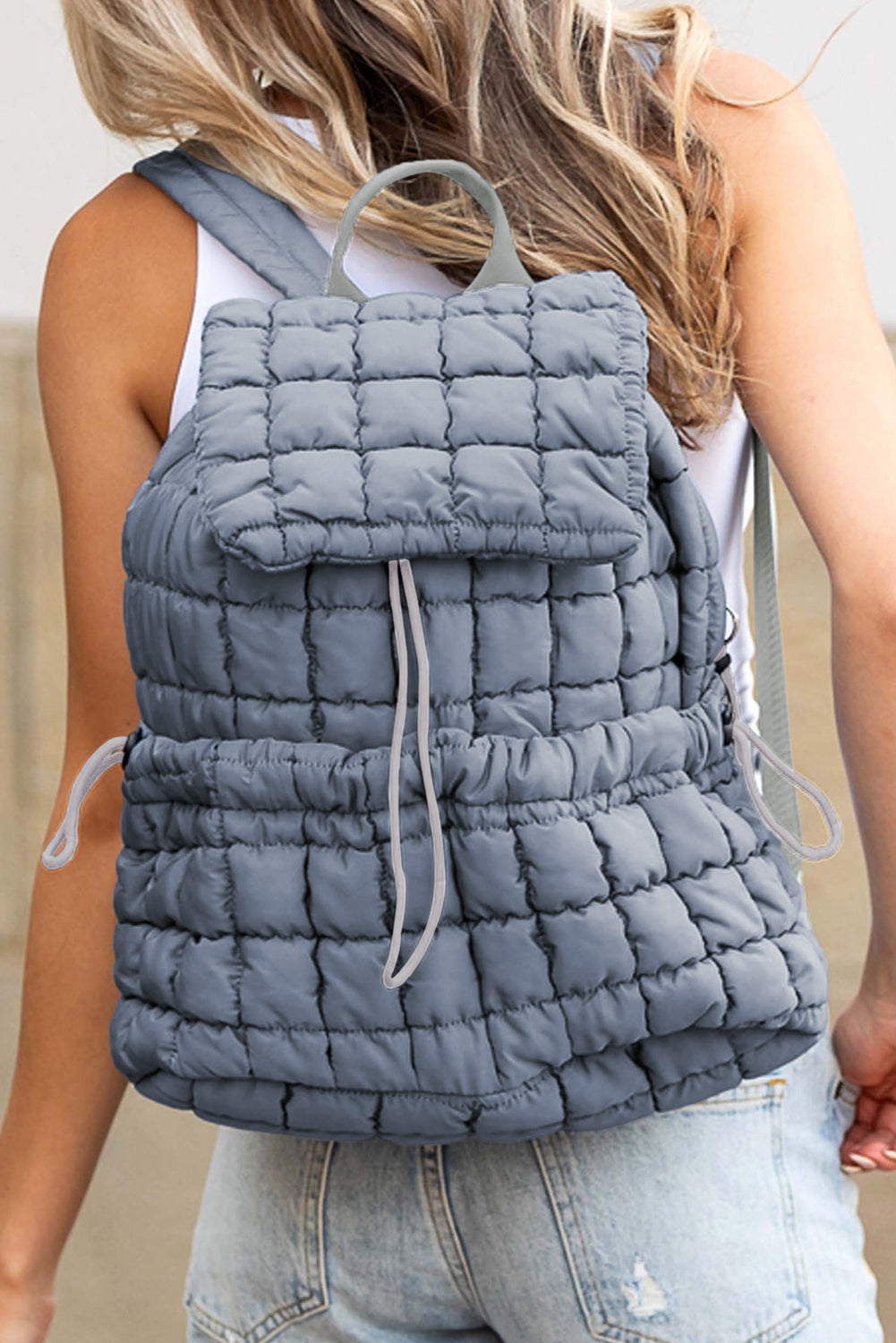 Modern black puffer backpack with quilted design and sleek look