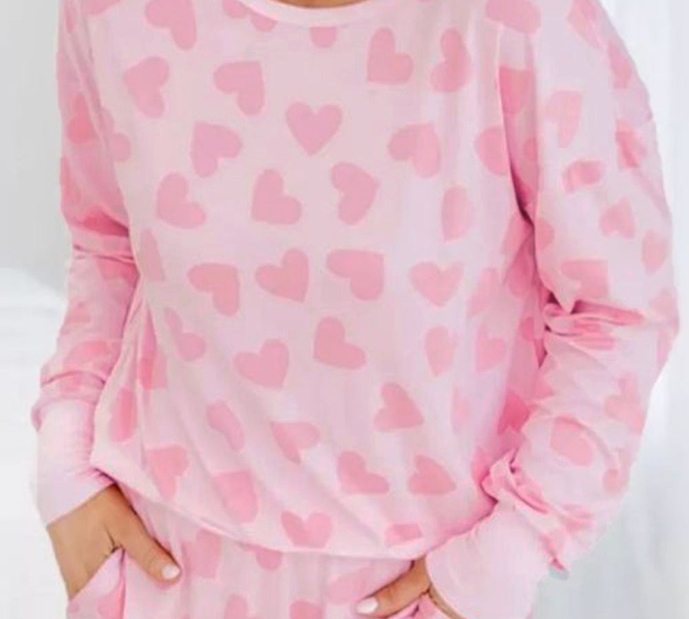 Cozy and stylish pink plus-size sweater with heart checkered design