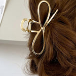 Fashionable gold bowknot hair clip perfect for any occasion
