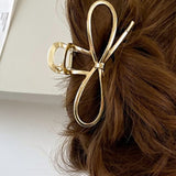Fashionable gold bowknot hair clip perfect for any occasion