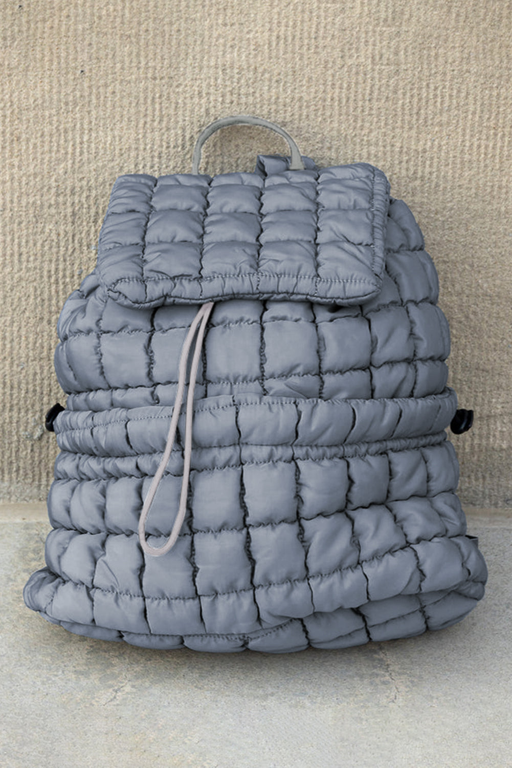 Modern black puffer backpack with quilted design and sleek look
