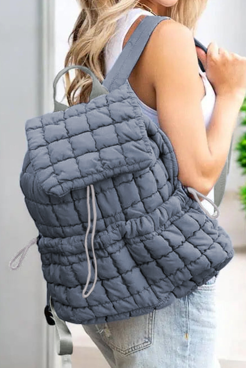 Modern black puffer backpack with quilted design and sleek look