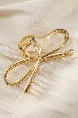 Fashionable gold bowknot hair clip perfect for any occasion