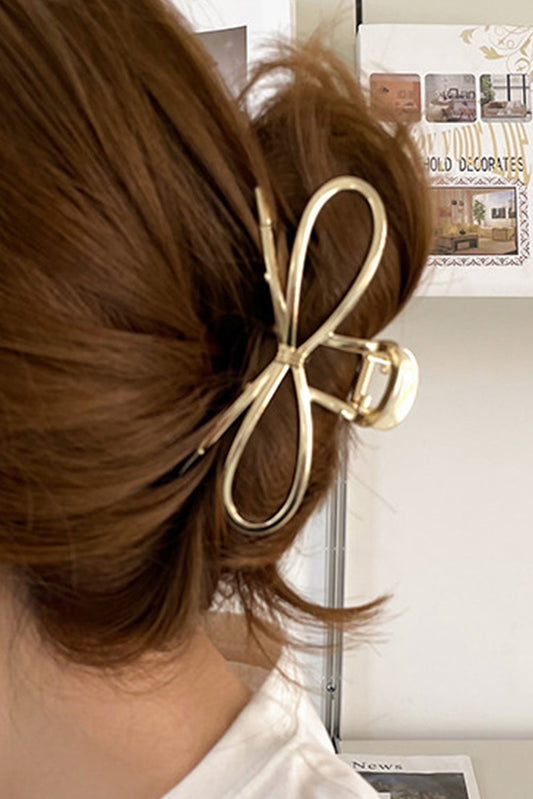 Gold metal bow hair clip for a trendy and refined style