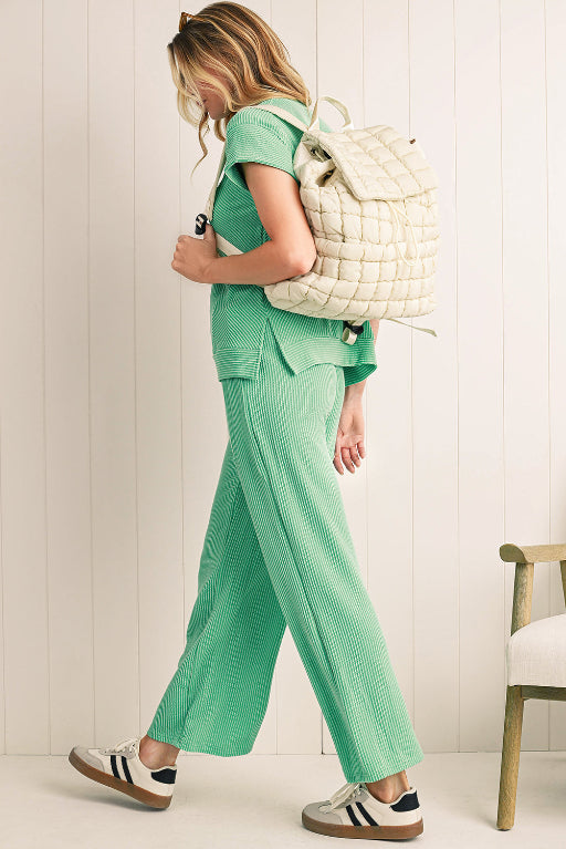 Modern black puffer backpack with quilted design and sleek look