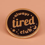 Always Tired Club enamel pin on denim jacket