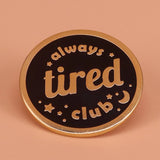 Always Tired Club enamel pin on denim jacket