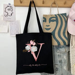 Close-up of a personalized canvas tote bag with custom initials