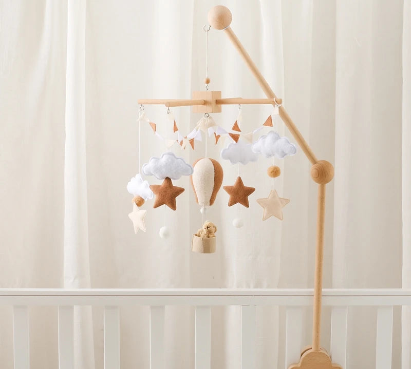 Wooden crib mobile toy with hanging figures