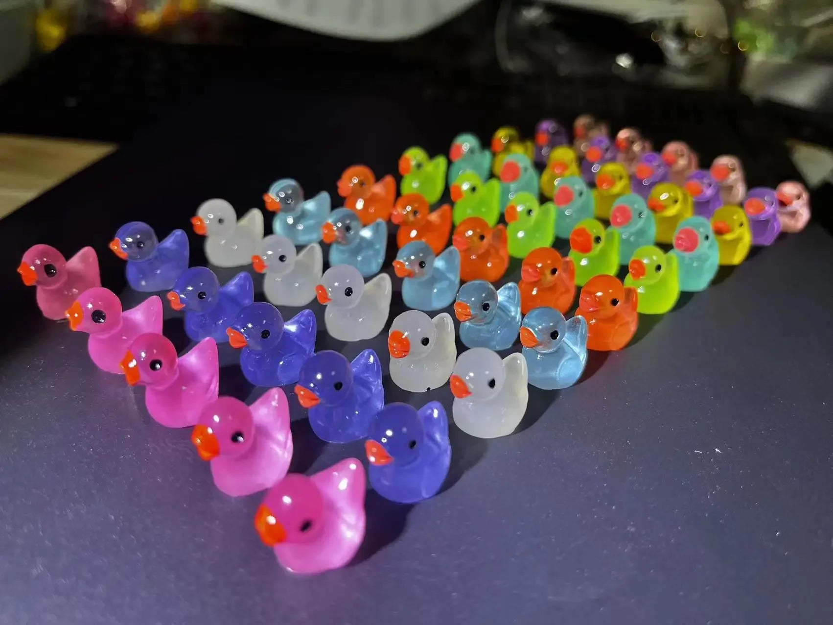 Luminous baby bath toys in duck shape glowing in dark