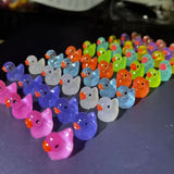 Luminous baby bath toys in duck shape glowing in dark