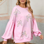 Elegant light pink sweatshirt with bow design for casual wear
