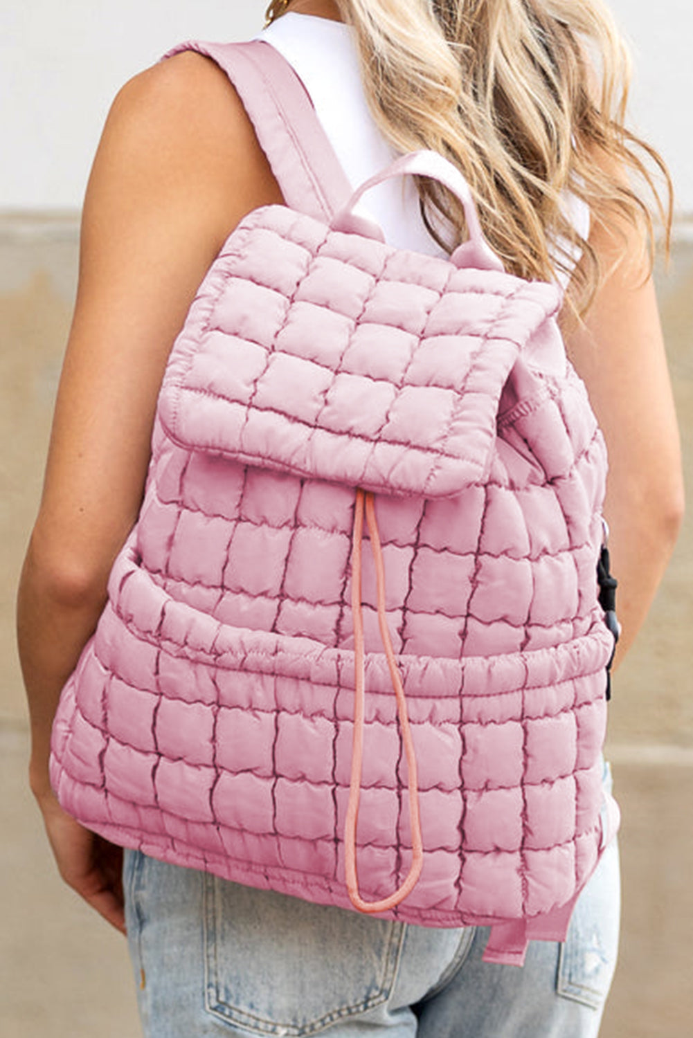 Modern black puffer backpack with quilted design and sleek look