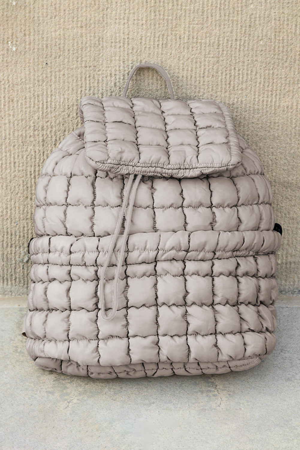 Modern black puffer backpack with quilted design and sleek look