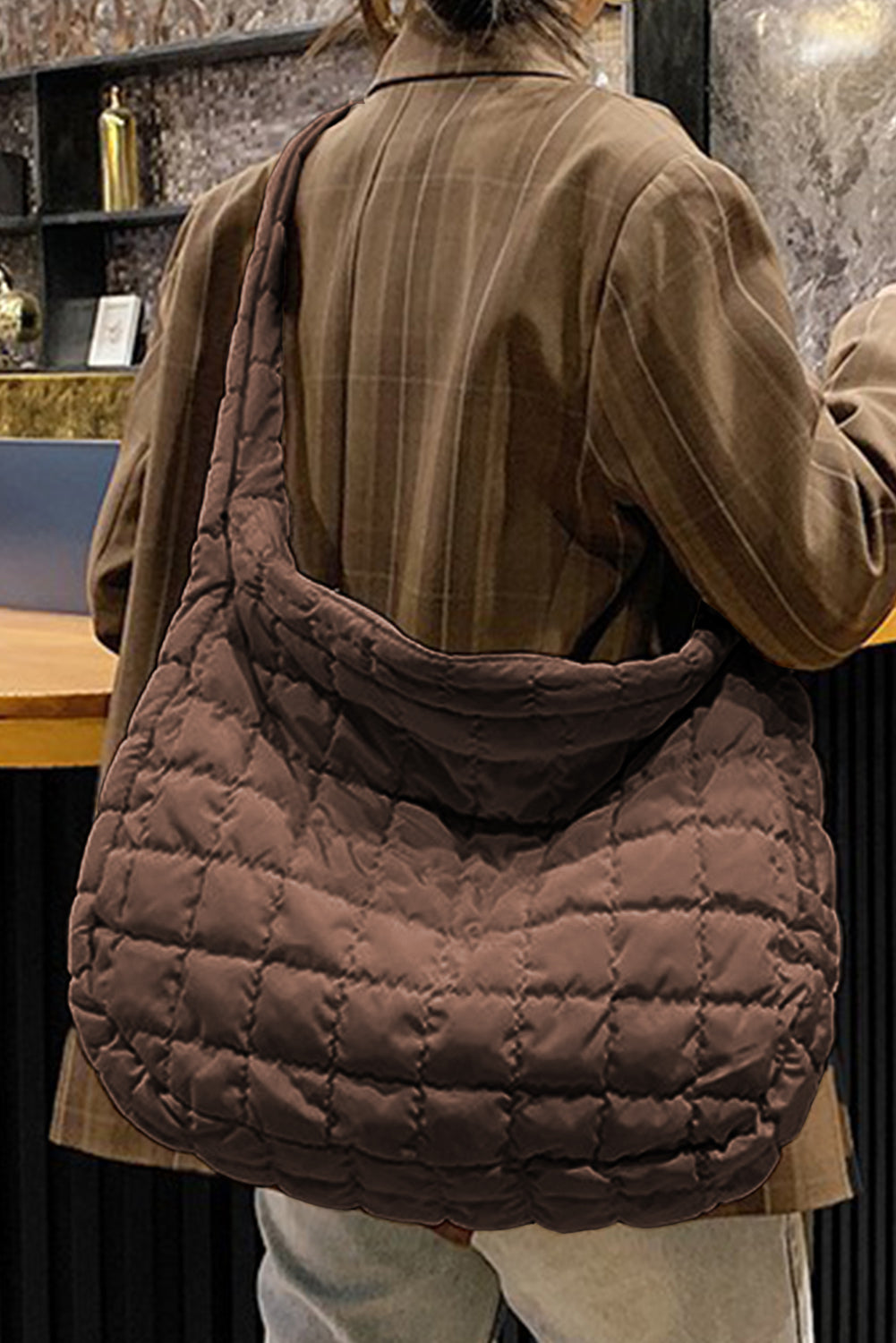 Spacious beige quilted large shoulder bag with a comfortable strap