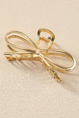 Chic gold bowknot hair accessory for sophisticated hairstyles