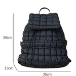 Modern black puffer backpack with quilted design and sleek look